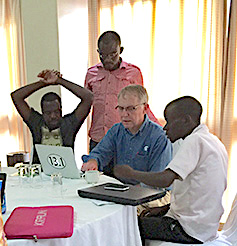 African journalists line up for editing by author David Poulson of SEJ, who traveled to Malawi, Rwanda and Peru last summer to help researchers and journalists explain agricultural issues to the public. 